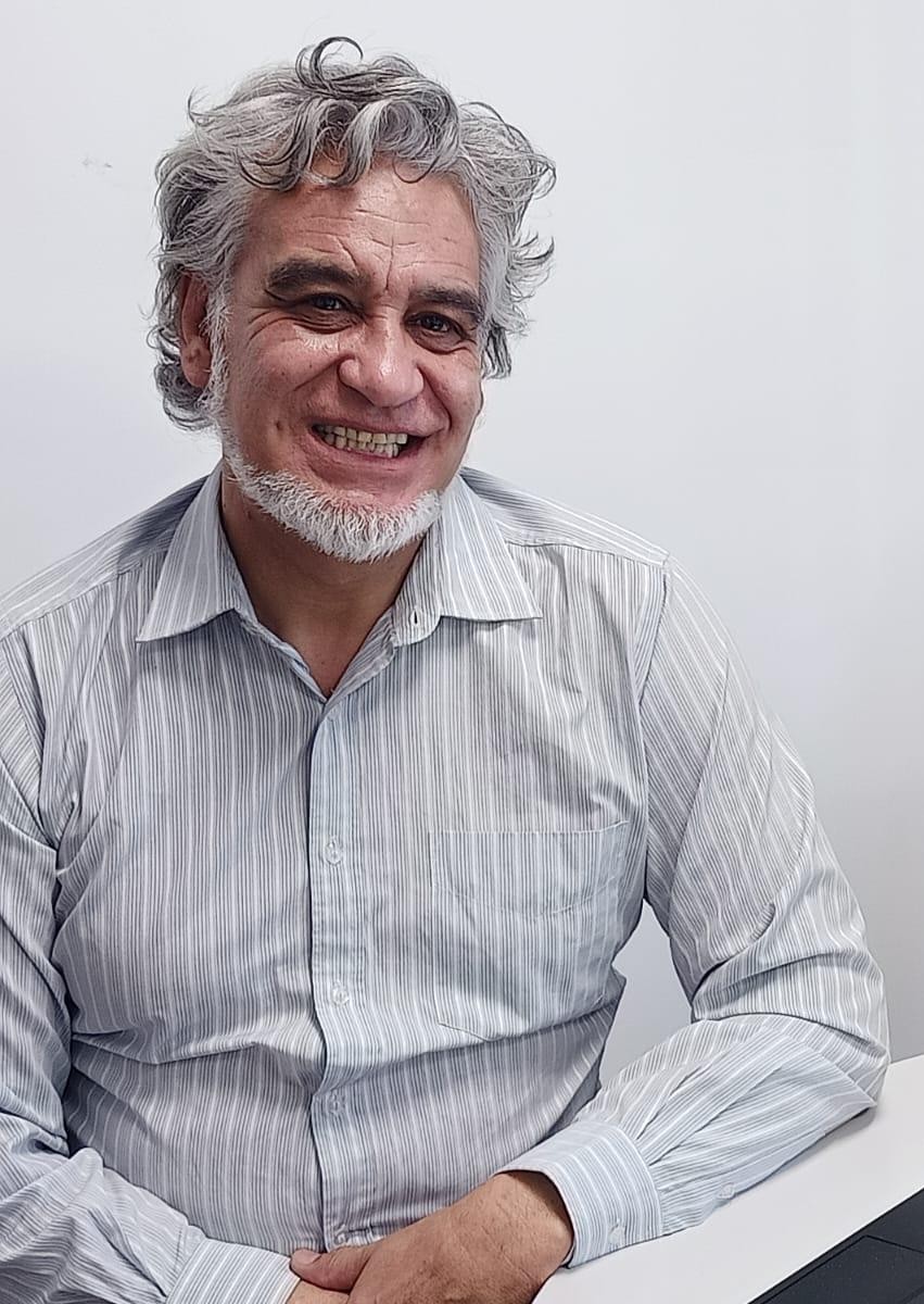 Picture of a smiling Māori man, Wareko Te Angina, a professional translator who works with Sexual Wellbeing Aotearoa.